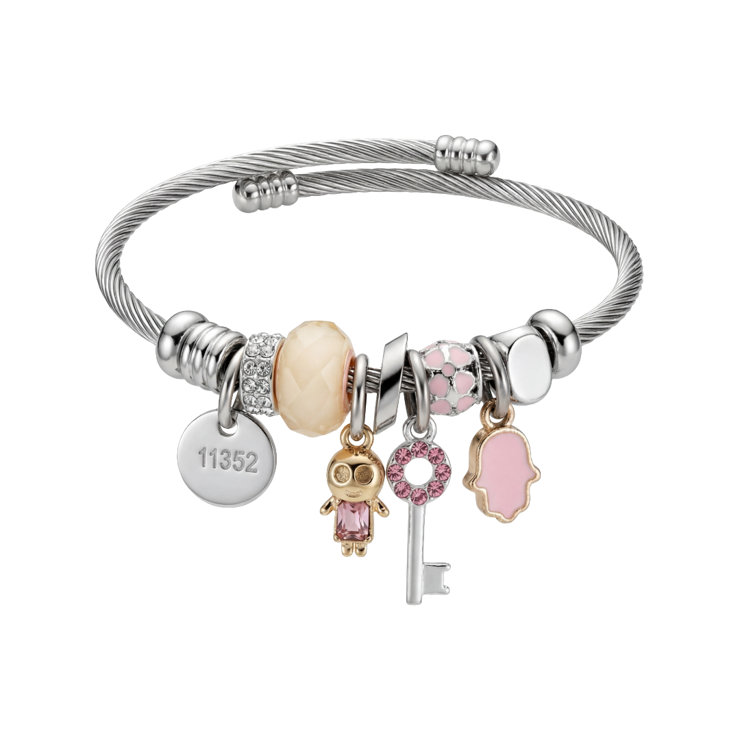 Silver bracelet with various charms on a white background