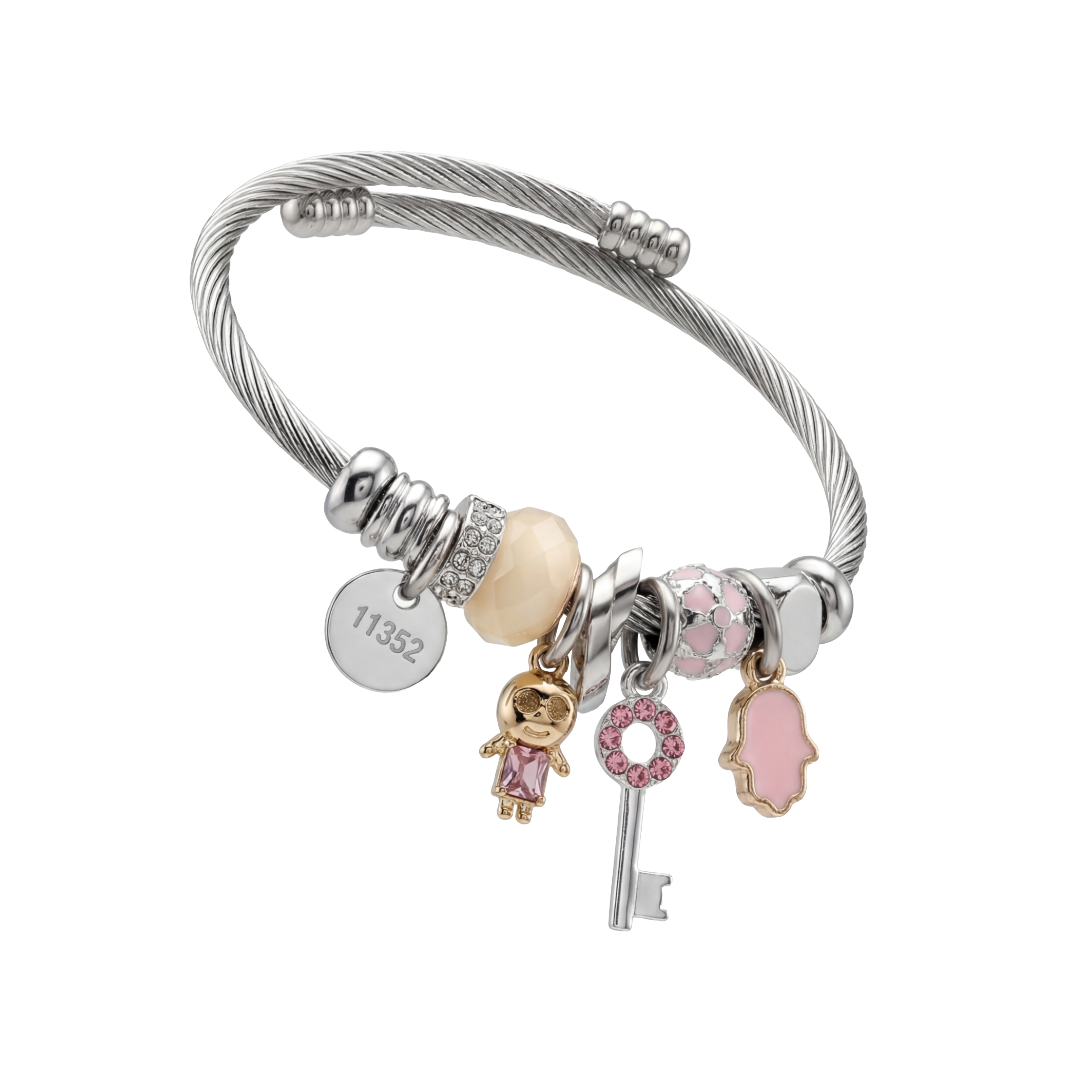 Silver bracelet with various charms on a white background