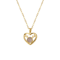 Gold heart-shaped necklace with a pink gemstone on a white background