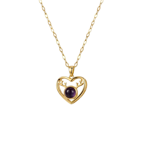 Gold heart-shaped necklace with a purple gemstone on a white background