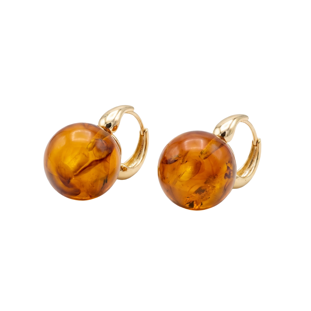 Pair of amber hoop earrings with gold loops on a white background