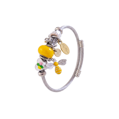 Silver bracelet with colorful charms on a white background