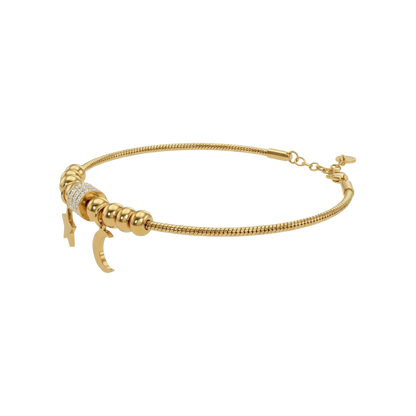Gold bracelet with a unique clasp design on a white background