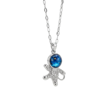 Starfish-shaped pendant with a blue gemstone on a white background