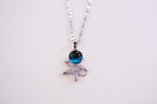 Silver necklace with a blue gemstone pendant on a white background