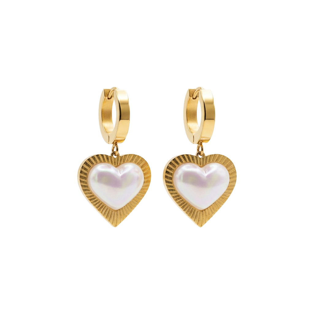 Gold heart-shaped earrings with pearl center on a white background