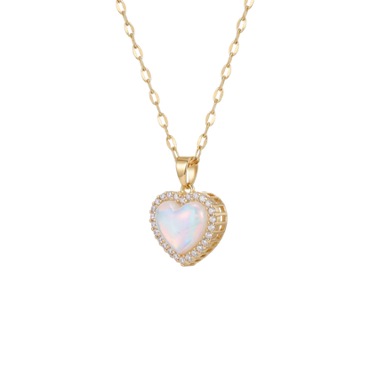 Gold necklace with a heart-shaped pendant on a white background
