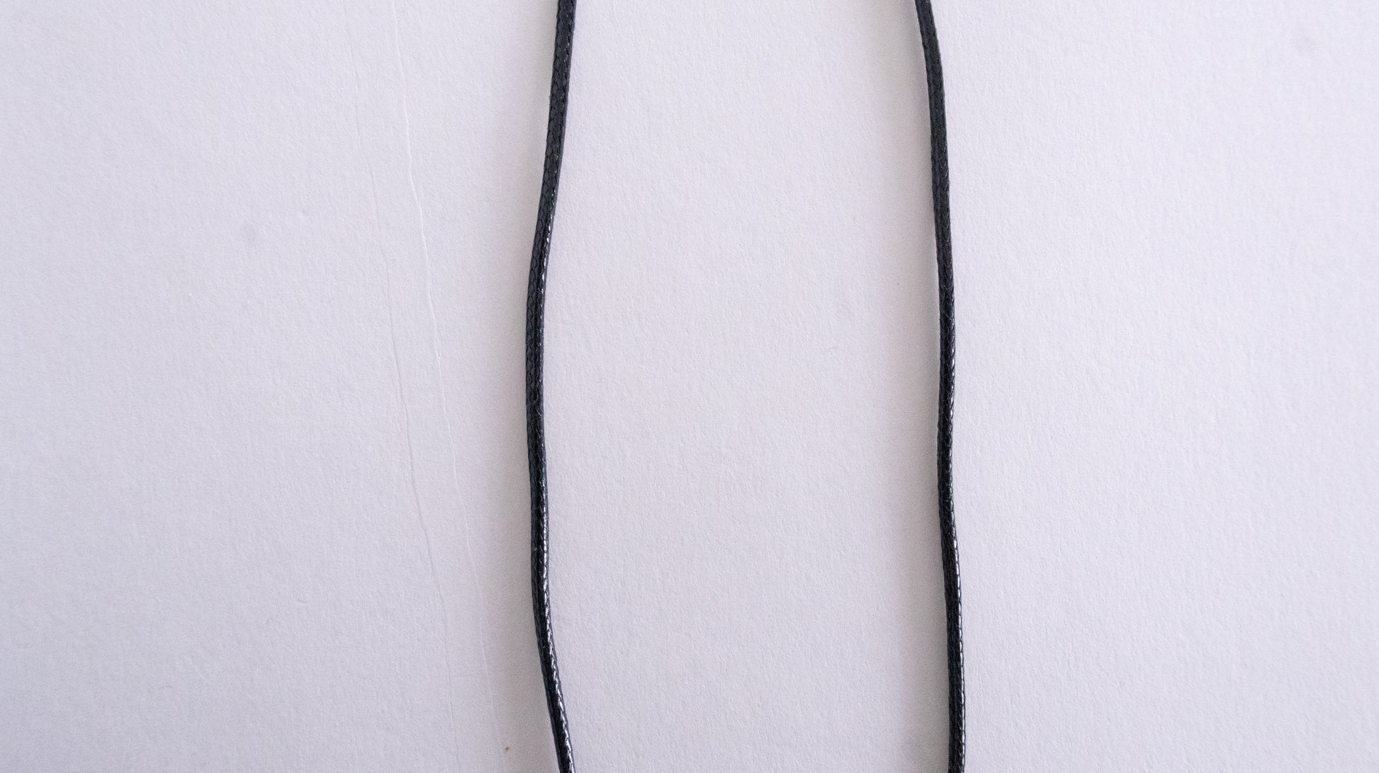 Thin black line on a white background