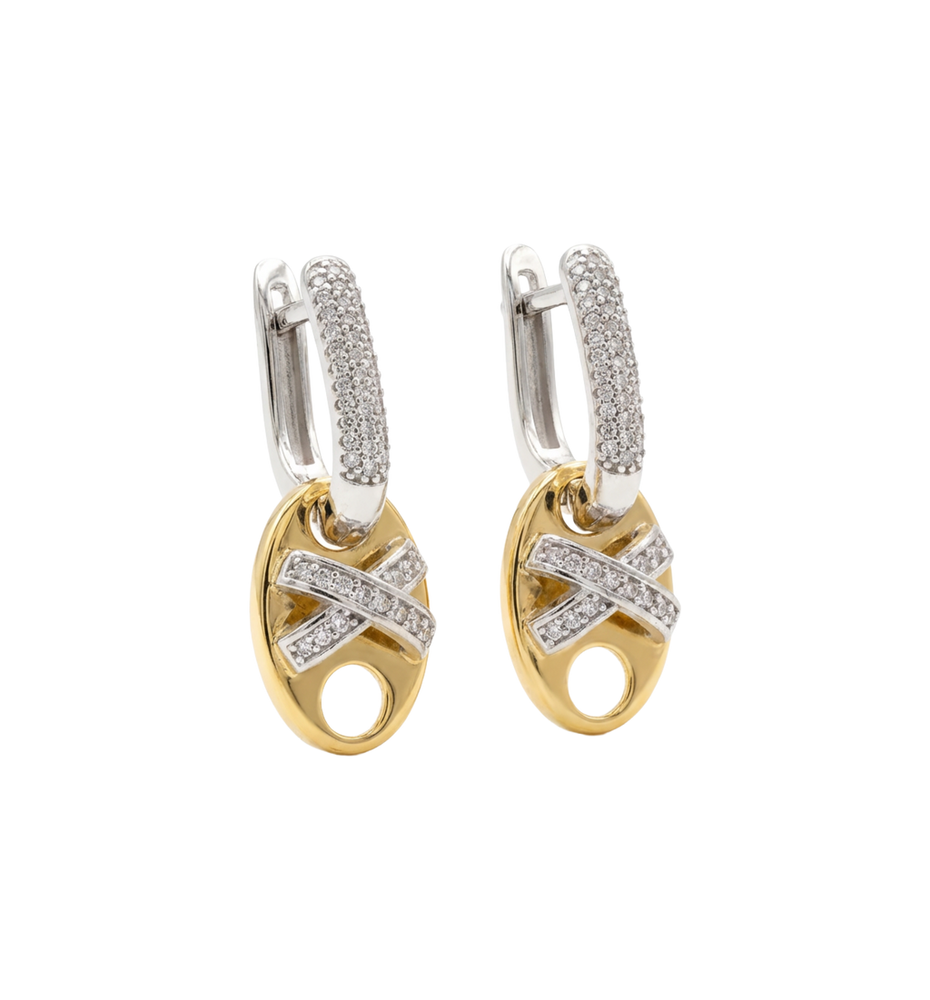 Pair of gold and silver hoop earrings with diamond accents on a white background