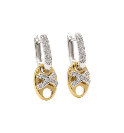 Pair of gold and silver hoop earrings with diamond accents on a white background