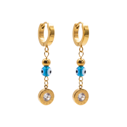 Gold hoop earrings with blue beads and clear stones on a white background