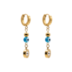 Gold hoop earrings with blue evil eye beads and clear stones on a white background