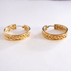 Pair of gold hoop earrings on a white background