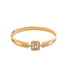 Gold bracelet with a square clasp on a white background