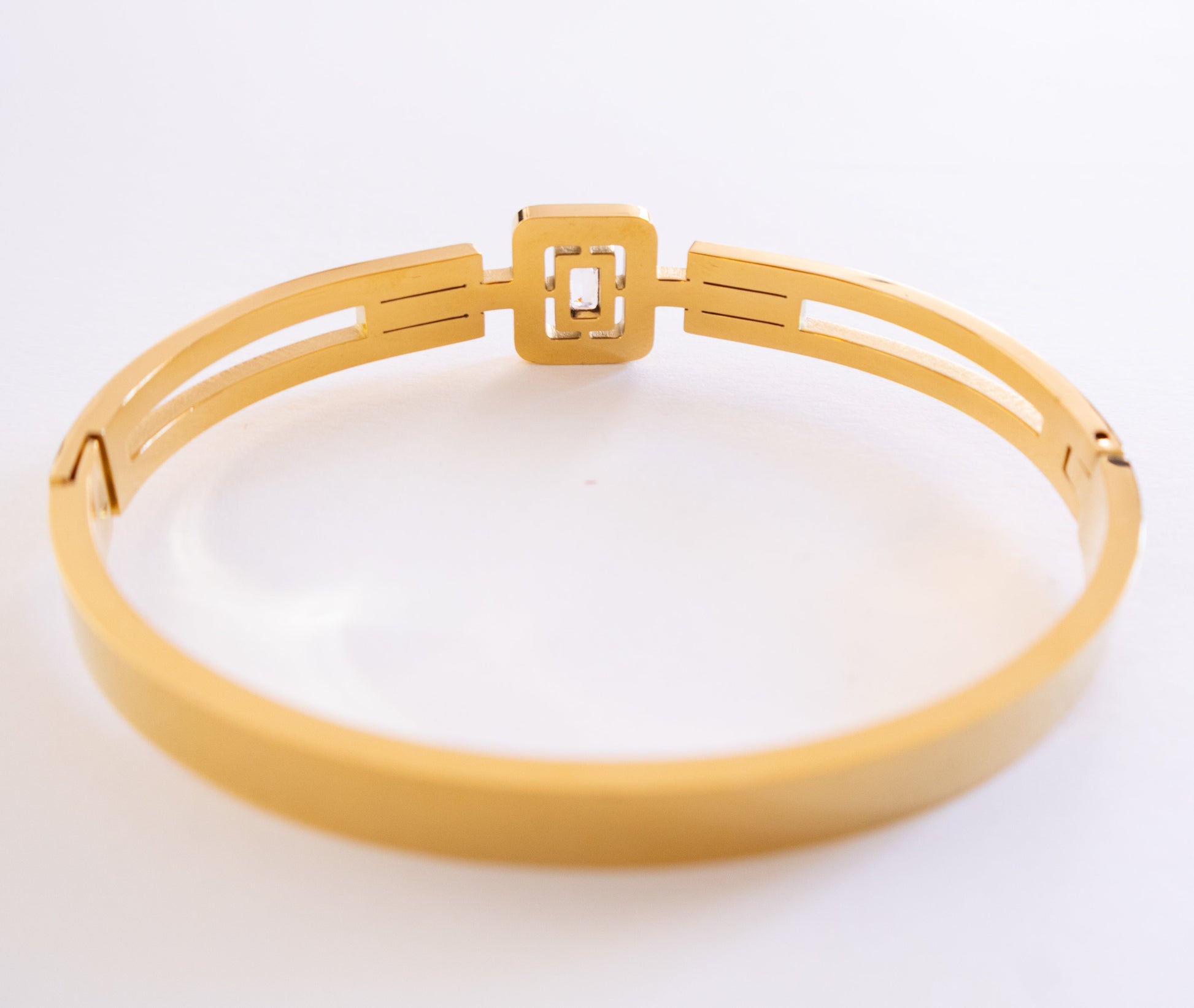 Gold bracelet on a white background