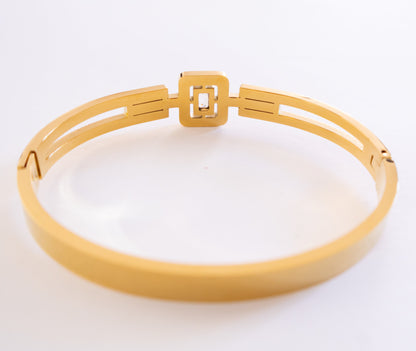 Gold bracelet on a white background