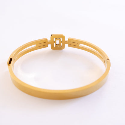 Gold bracelet on a white background