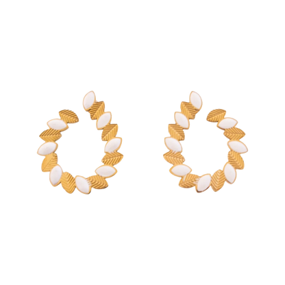Pair of gold and white hoop earrings on a white background