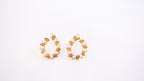 Pair of gold hoop earrings on a white background