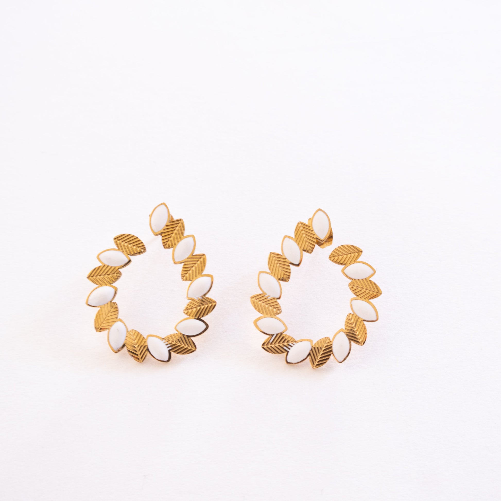 Pair of gold hoop earrings on a white background