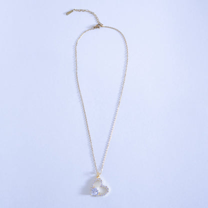 Necklace with a heart-shaped pendant on a light blue background