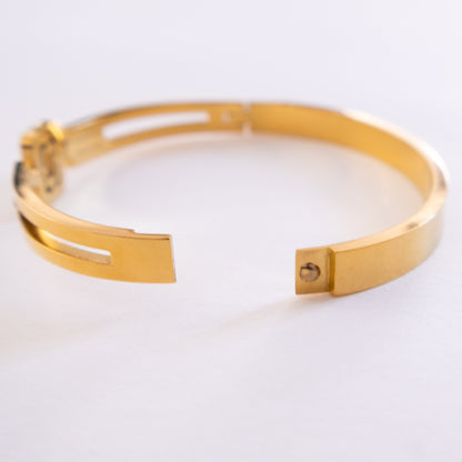 Gold bracelet on a white background