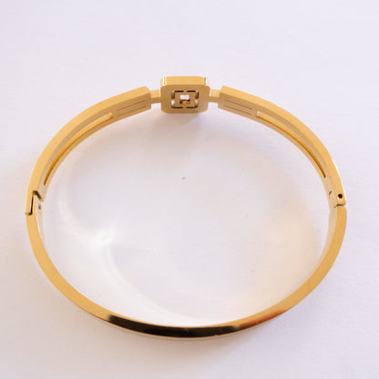 Gold bracelet on a white background