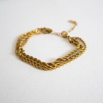Gold chain bracelet on a white background