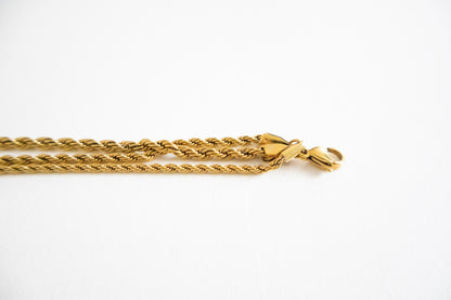 Gold chain necklace on a white background