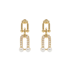 Gold earrings with pearl and diamond-like stones on a white background