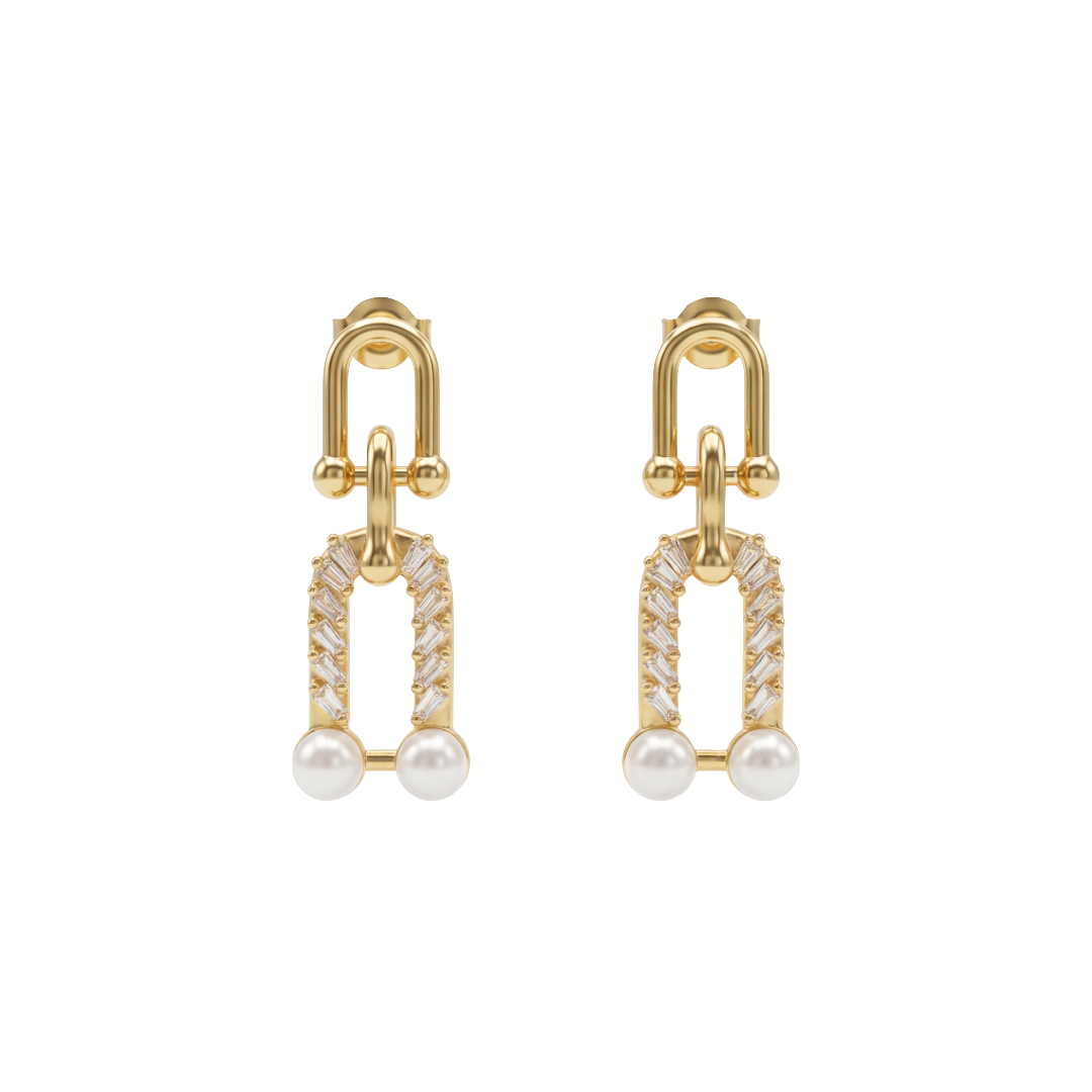 Gold earrings with pearl and diamond-like stones on a white background