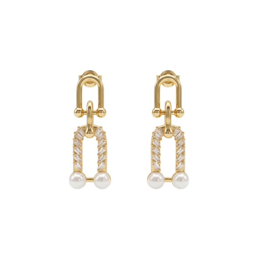 Gold earrings with pearl and diamond-like stones on a white background