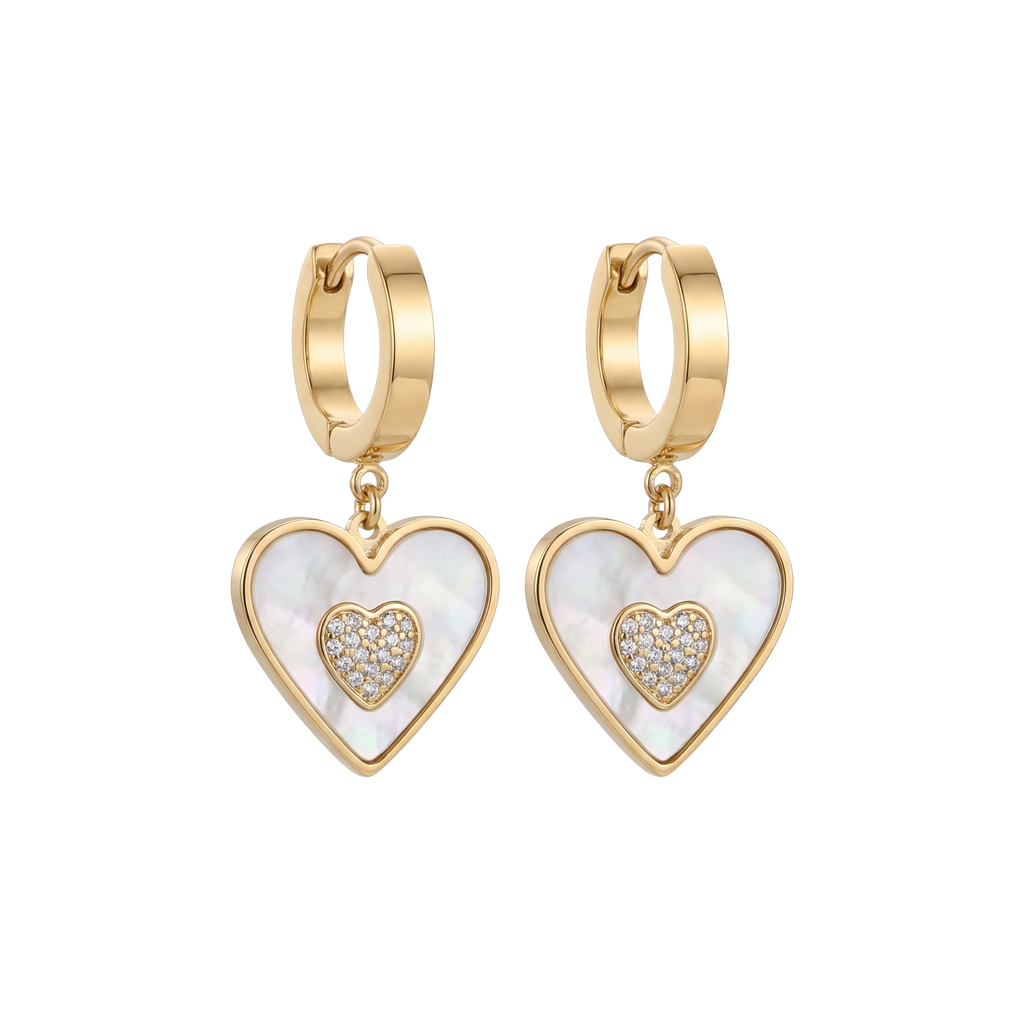 Gold heart-shaped earrings with white center and clear stones on a white background