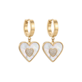 Gold heart-shaped earrings with white center and clear stones on a white background