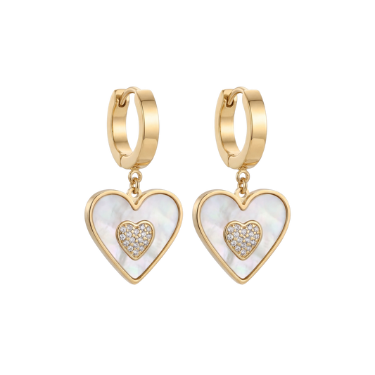 Gold heart-shaped earrings with white center and clear stones on a white background