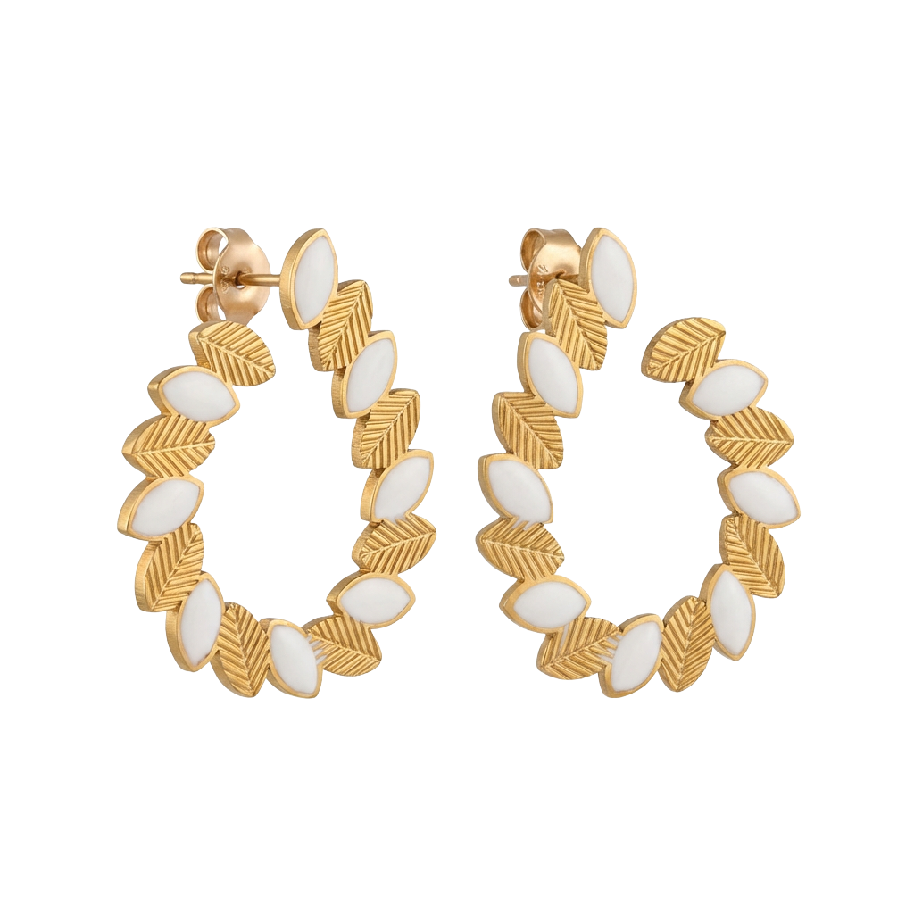 Gold hoop earrings with white accents on a white background
