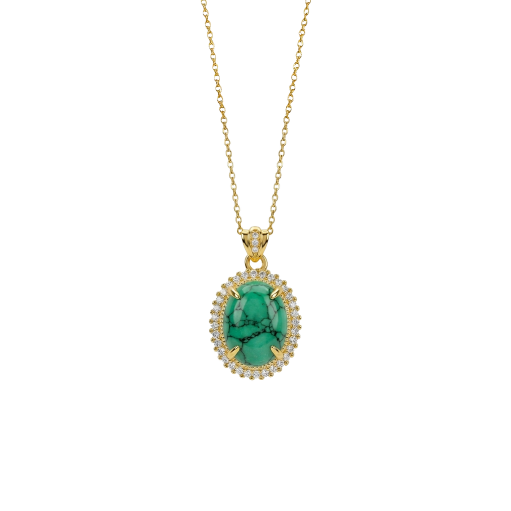 Gold necklace with a green pendant on a white background