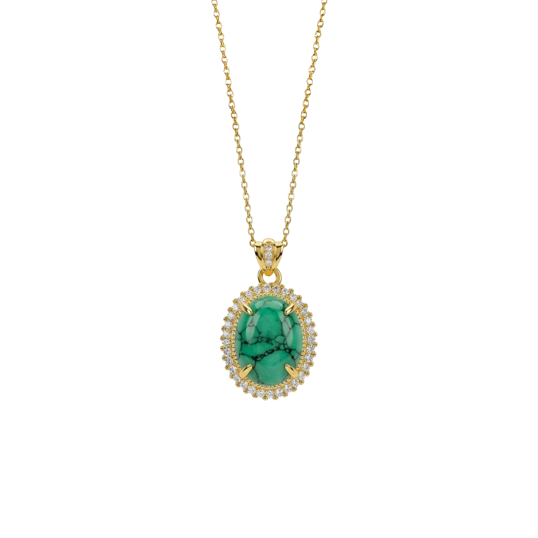 Gold necklace with a green pendant on a white background