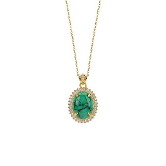 Gold necklace with a green pendant on a white background