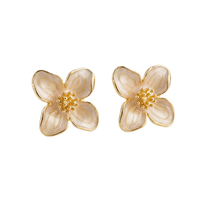 Pair of flower-shaped earrings with gold accents on a white background