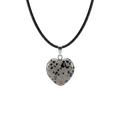 Heart-shaped dalmatian Jasper pendant on a black cord against a white background