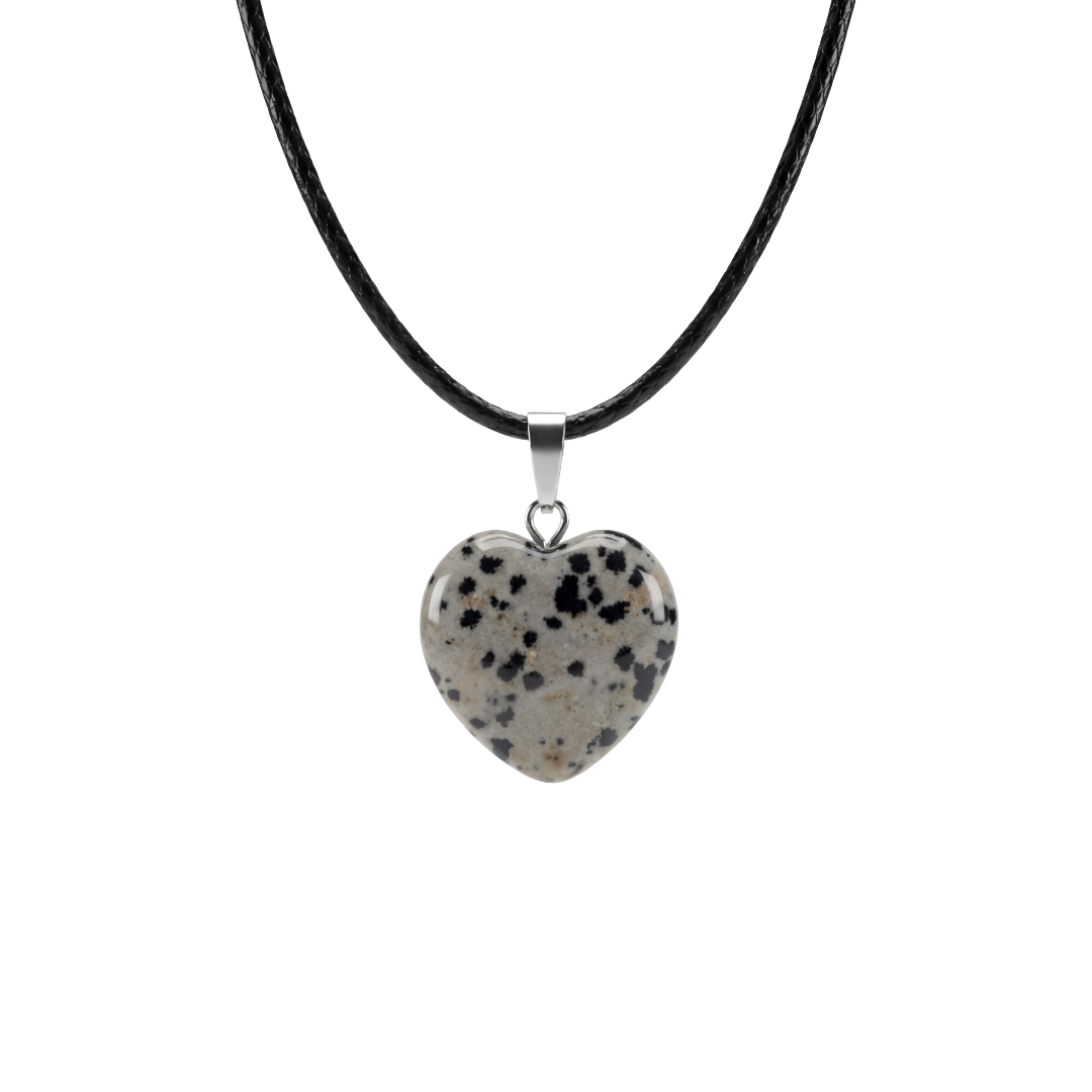 Heart-shaped dalmatian Jasper pendant on a black cord against a white background