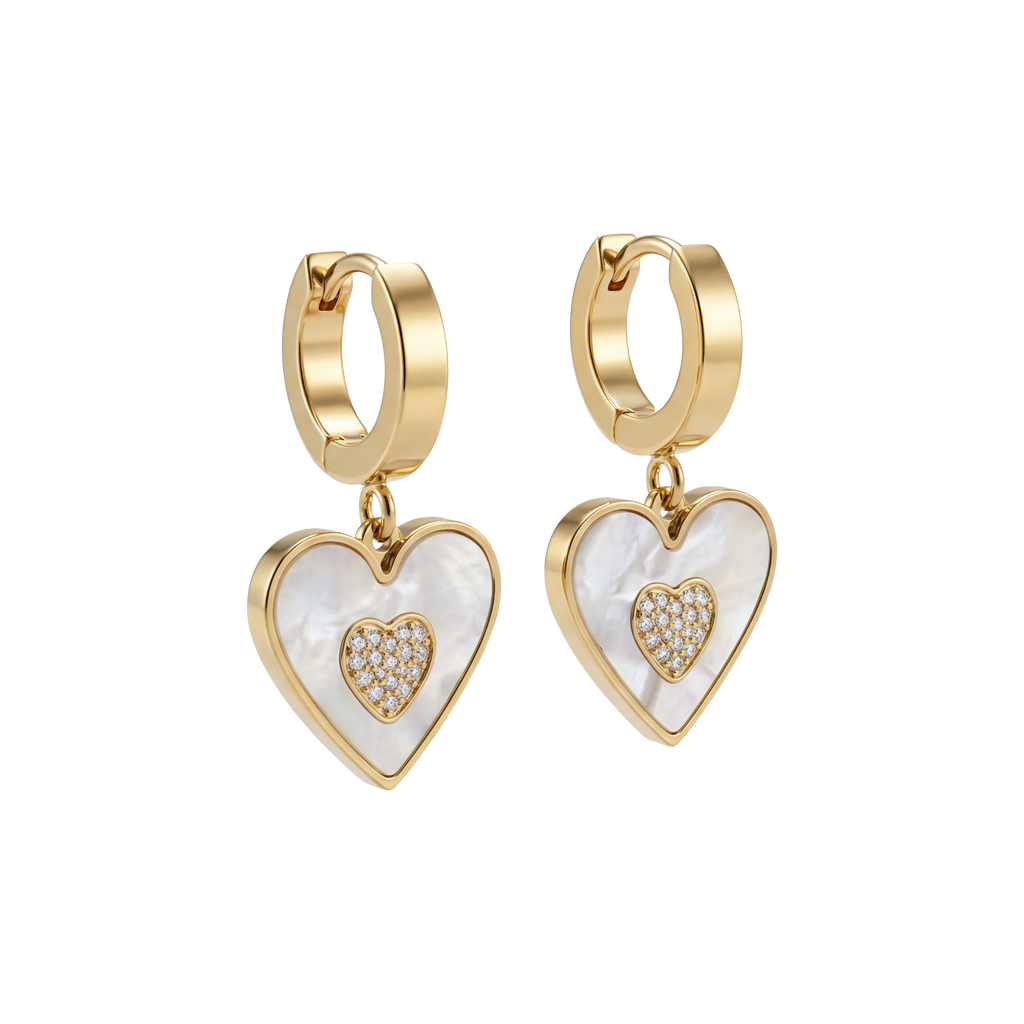Heart-shaped earrings with gold and white details on a white background