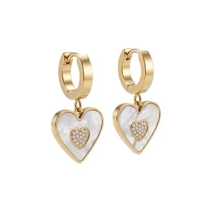 Heart-shaped earrings with gold and white details on a white background