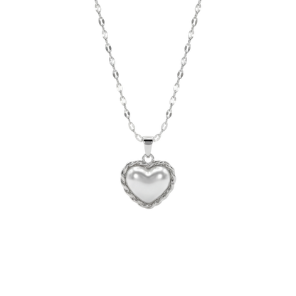 Heart-shaped silver pendant on a chain against a white background