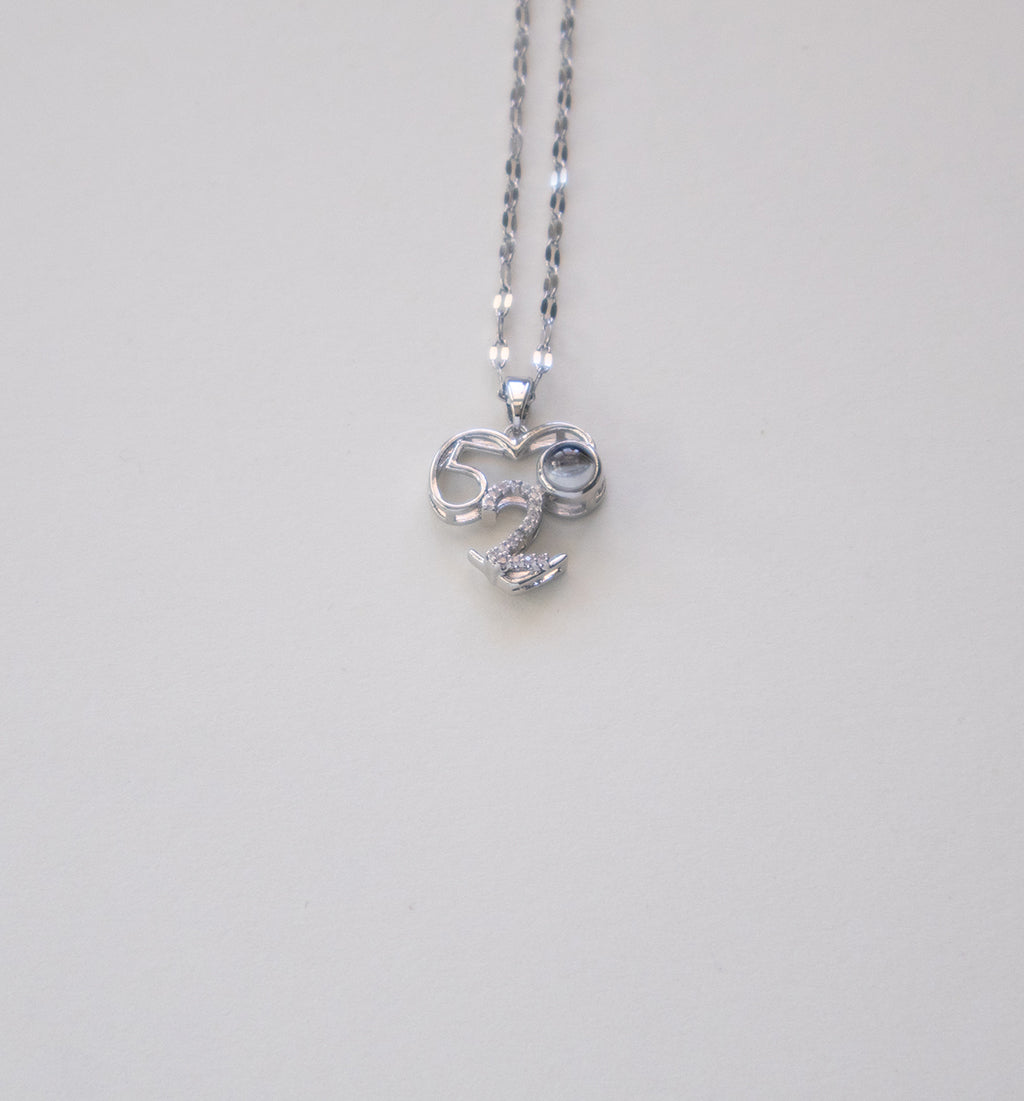 Stainless Steel Silver-Toned Necklace with Number 52 Pendant and Dark Gemstone Accent