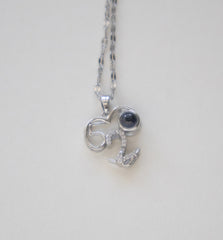 Stainless Steel Silver-Toned Necklace with Number 52 Pendant and Dark Gemstone Accent
