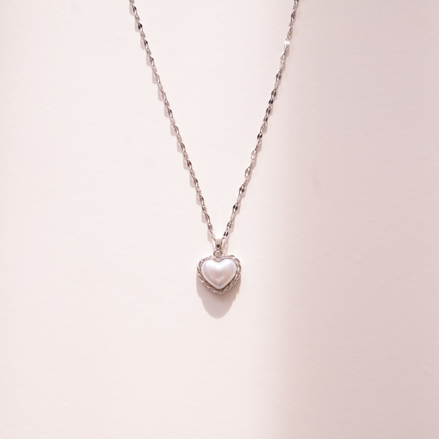 Bound Twisted Silver Heart Pendant Necklace