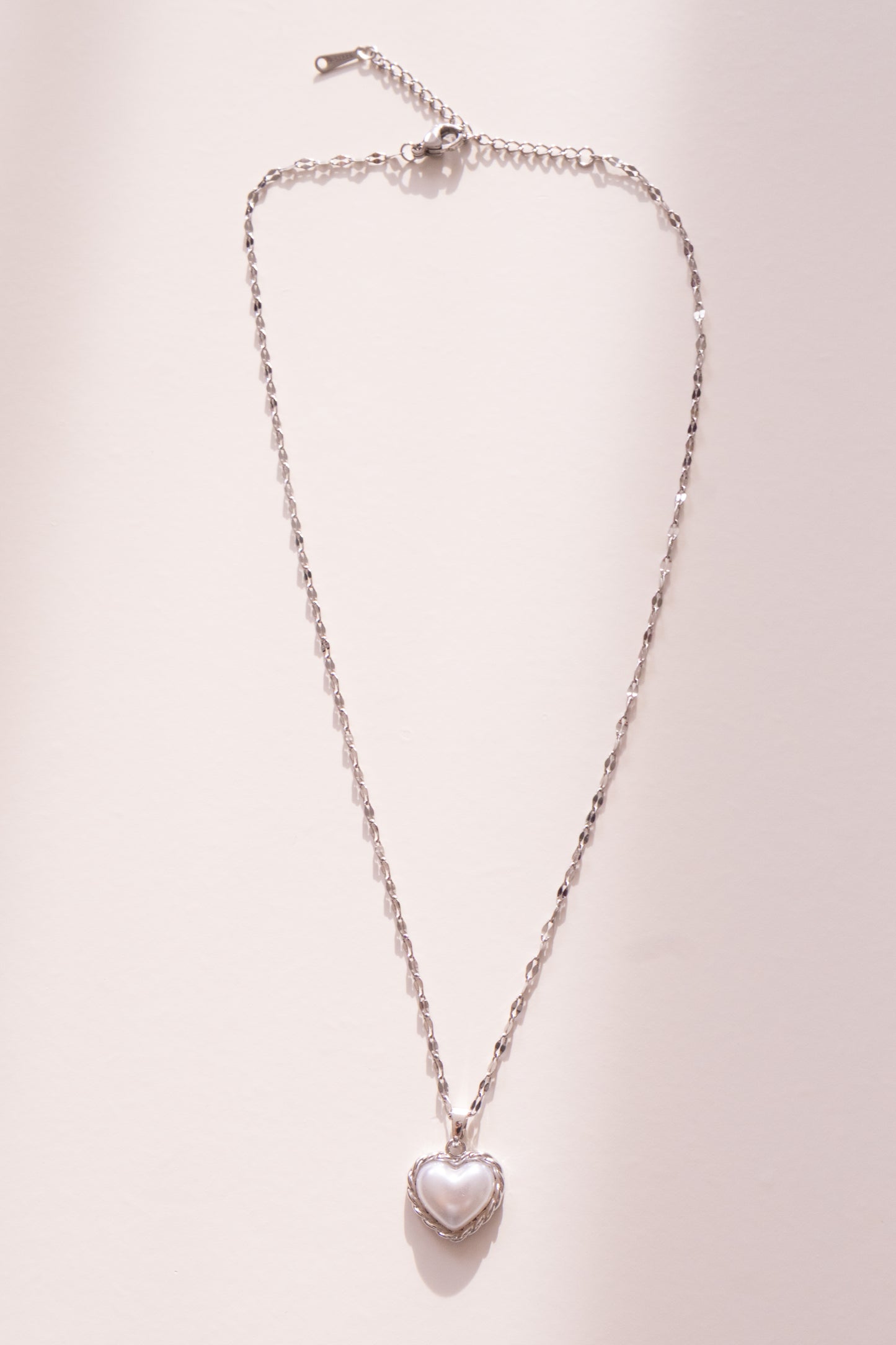 Bound Twisted Silver Heart Pendant Necklace