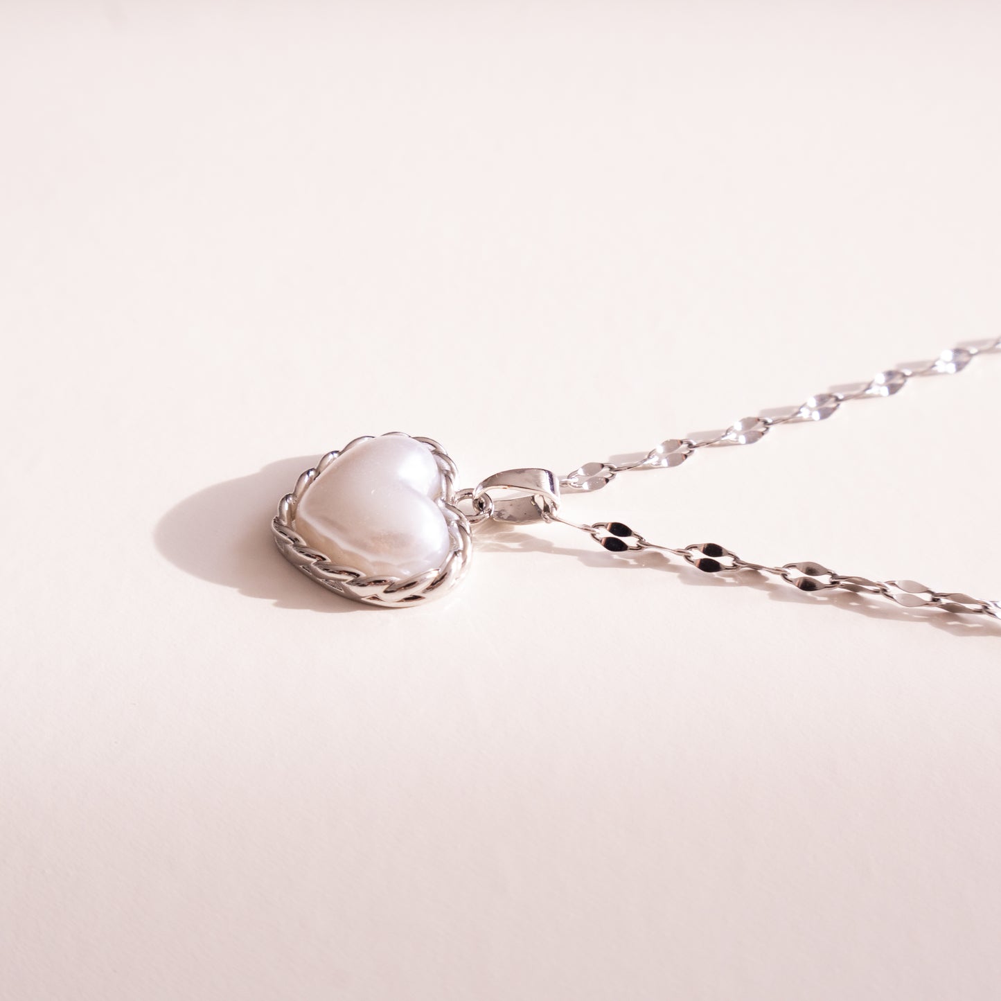 Bound Twisted Silver Heart Pendant Necklace